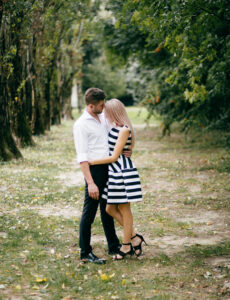 A couple posing during an elegant engagement photo session in Houston.