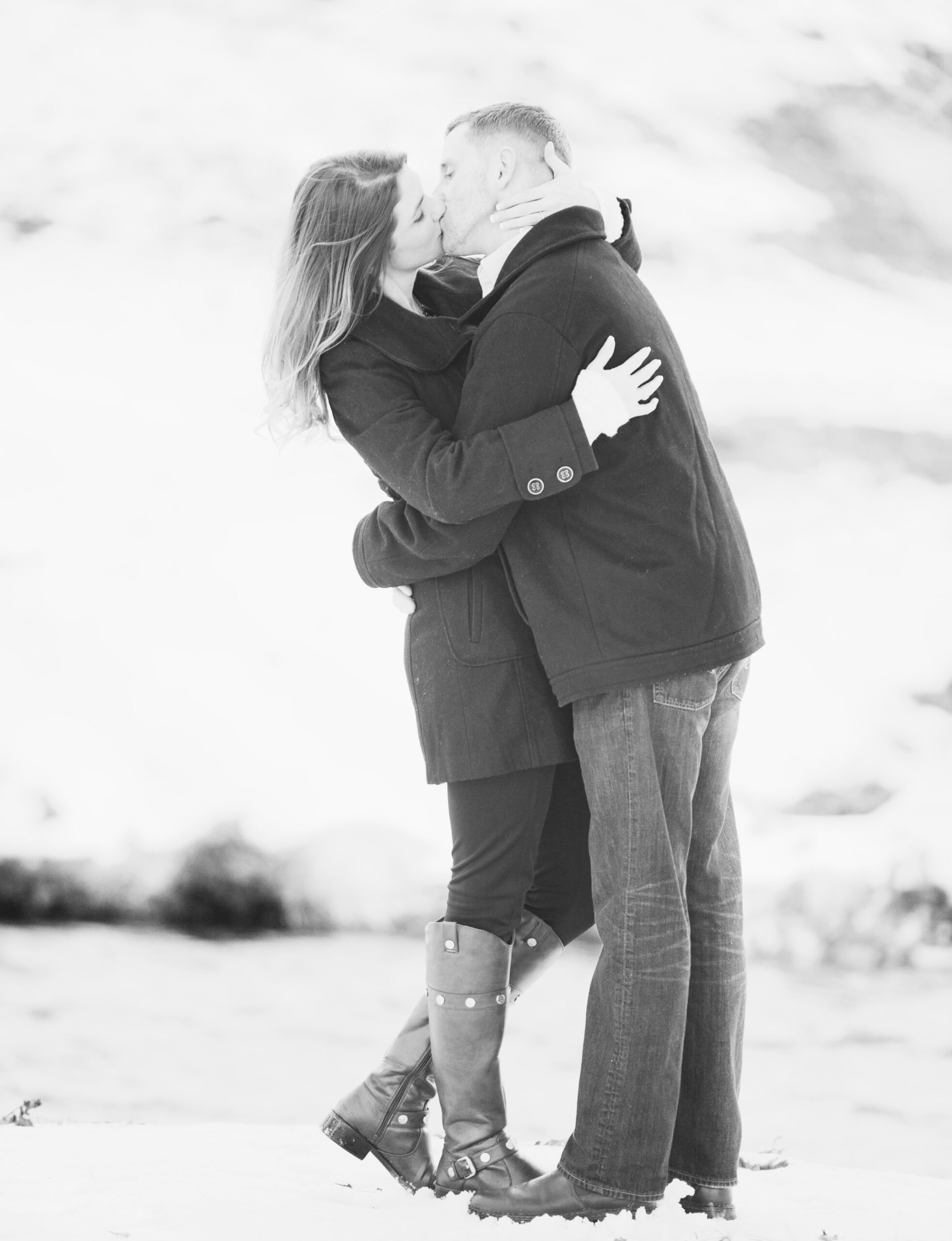 A couple in Houston posing for their engagement photo session at an elegant outdoor location.