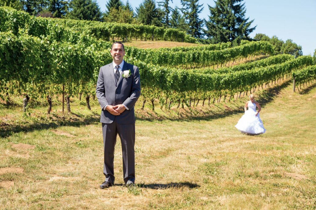 A bride and groom performing the trend of first looks on their wedding day.