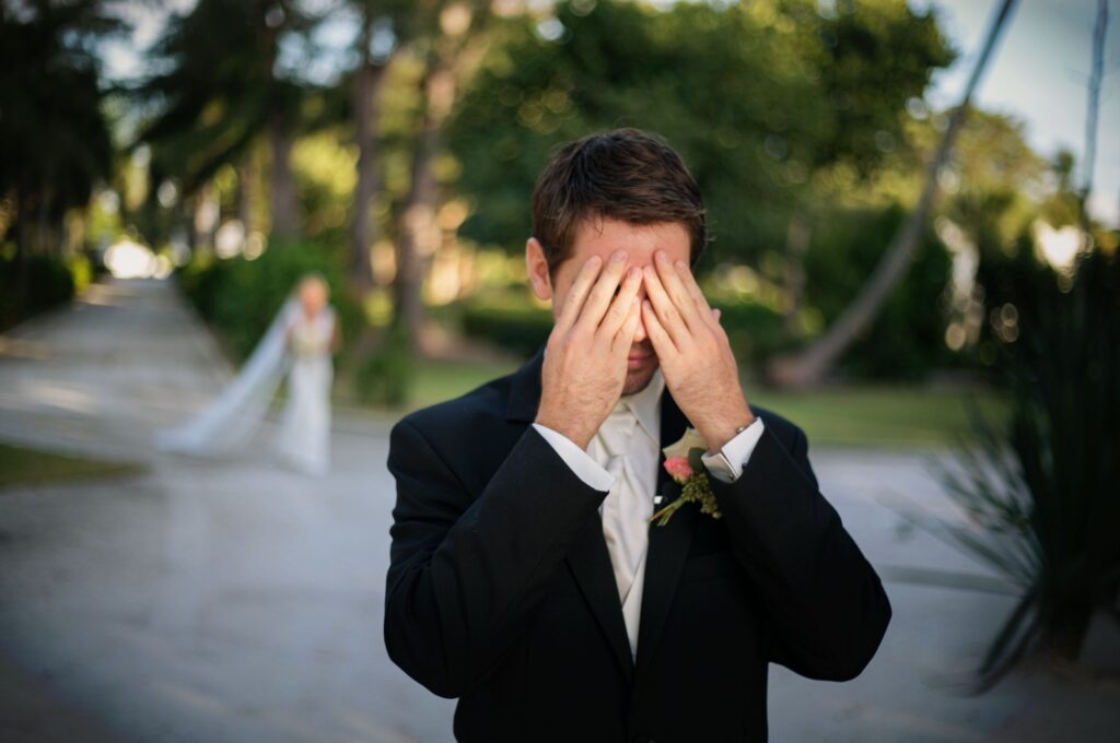 Bride and groom sharing an intimate first look moment before the ceremony.