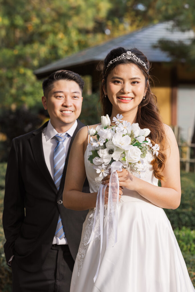 A groom approaches his bride for their first look.