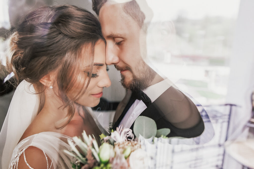 A bride and groom steal a private moment after the ceremony as they wait for guests to arrive at the cocktail hour.