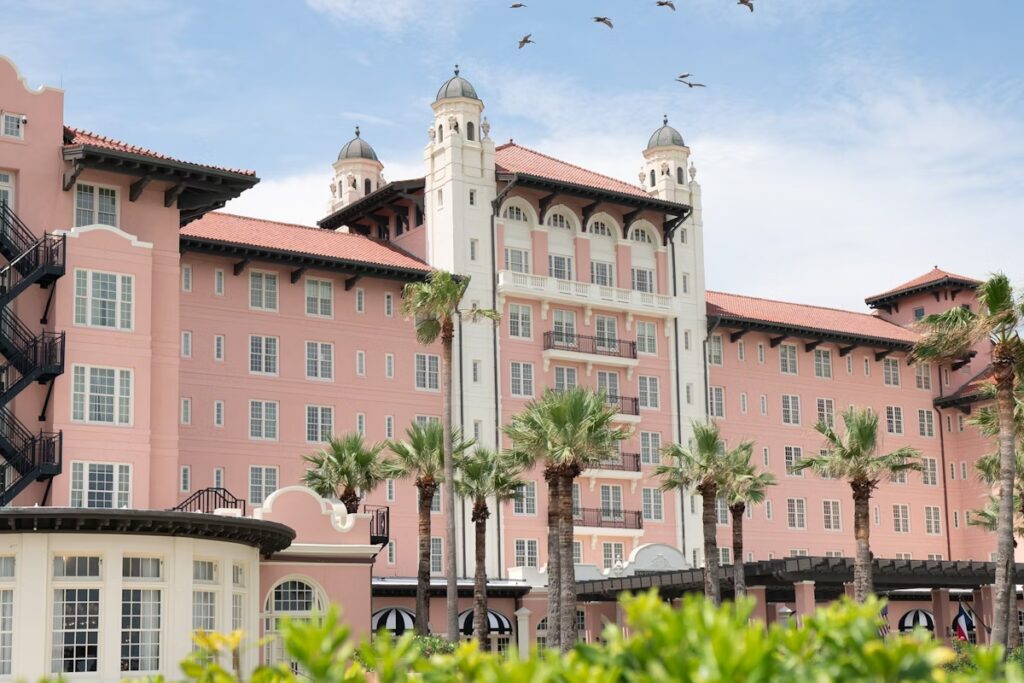 The Hotel Galvez is pictured in the late afternoon sun and is a Galveston Wedding Venue.